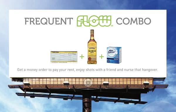 A FLOW billboard against open sky